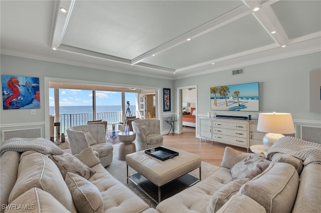 living room featuring coffered ceiling, ornamental molding, beam ceiling, and light hardwood / wood-style flooring