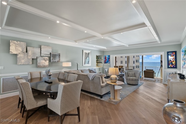 living room with hardwood / wood-style flooring, ornamental molding, and coffered ceiling