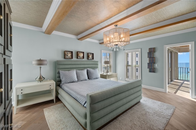 bedroom featuring a notable chandelier, ornamental molding, hardwood / wood-style floors, and beamed ceiling