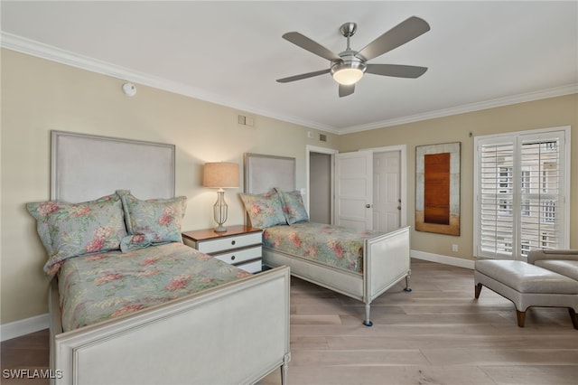 bedroom featuring crown molding, ceiling fan, and light hardwood / wood-style flooring