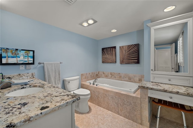 bathroom with tile patterned flooring, vanity, tiled bath, and toilet