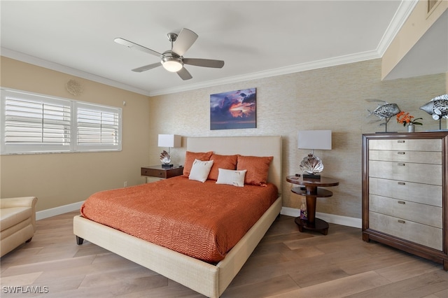 bedroom with hardwood / wood-style floors, ornamental molding, and ceiling fan