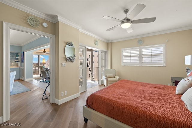 bedroom with ornamental molding, ceiling fan, and light wood-type flooring