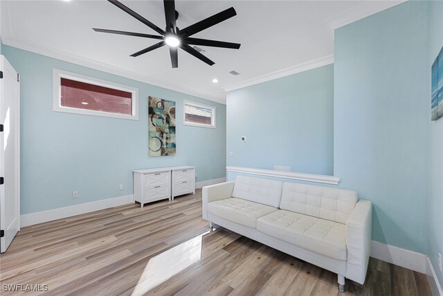 646 111th Ave N, Naples, FL 34108 - sitting room featuring crown molding, ceiling fan, wood finished floors, and recessed lighting