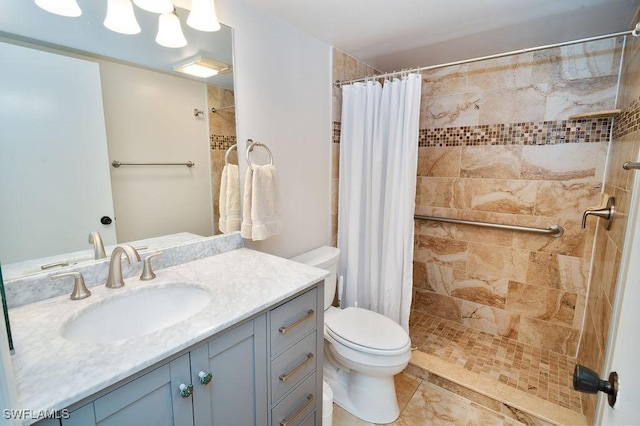 bathroom with vanity, tile patterned flooring, a shower with curtain, and toilet