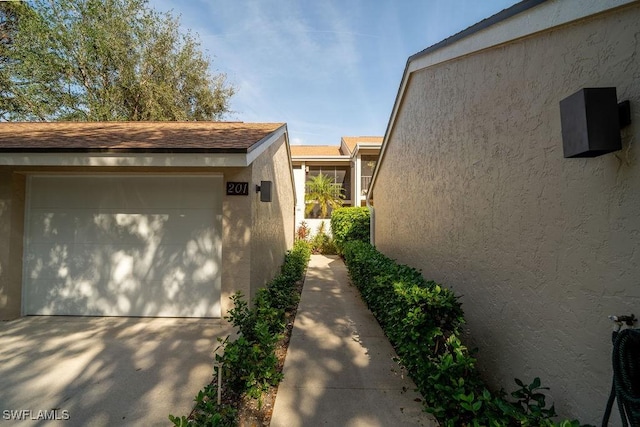 view of side of property featuring a garage