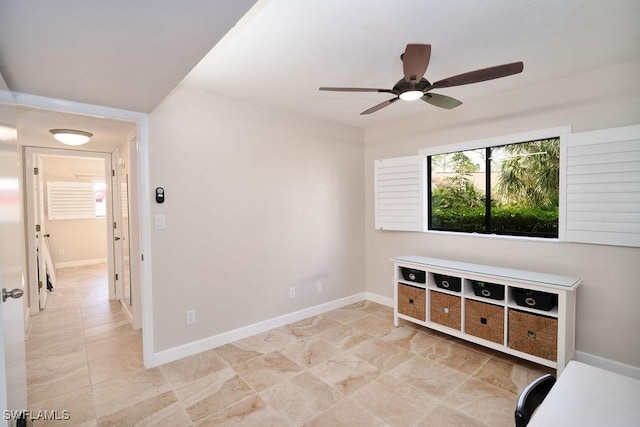 unfurnished living room featuring ceiling fan