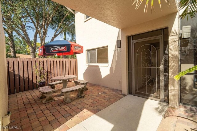 entrance to property with a patio