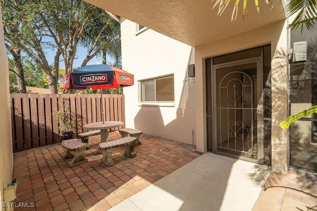 entrance to property with a patio area