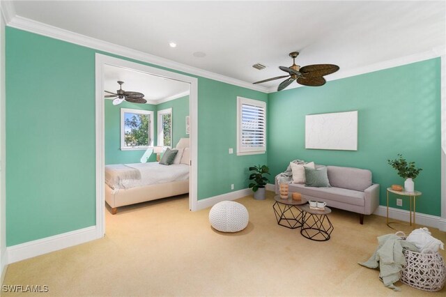 sitting room featuring ornamental molding, carpet flooring, plenty of natural light, and baseboards