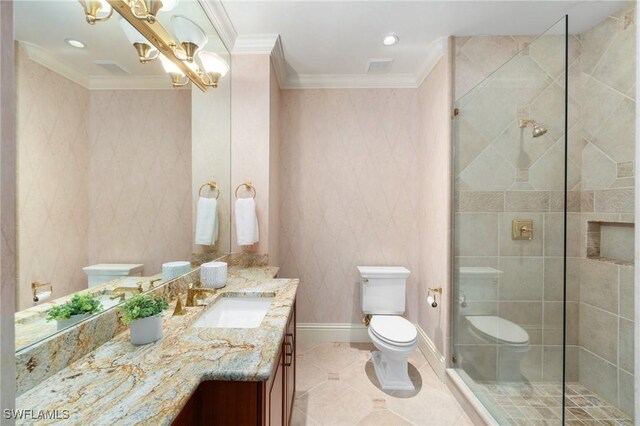 full bath with tiled shower, toilet, and crown molding