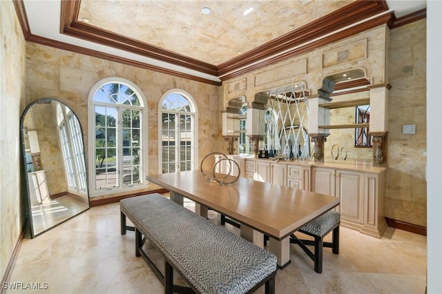 dining space featuring arched walkways and crown molding