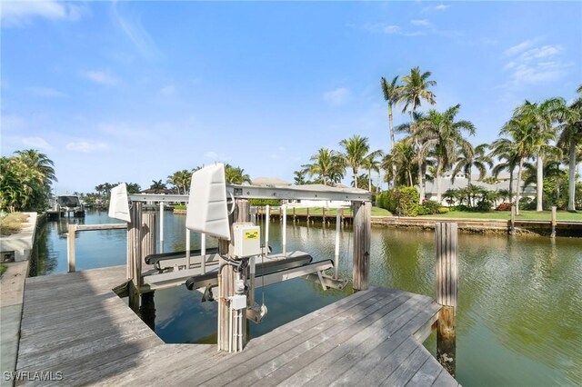 view of dock with a water view and boat lift