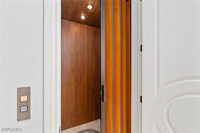 room details featuring wooden ceiling and recessed lighting