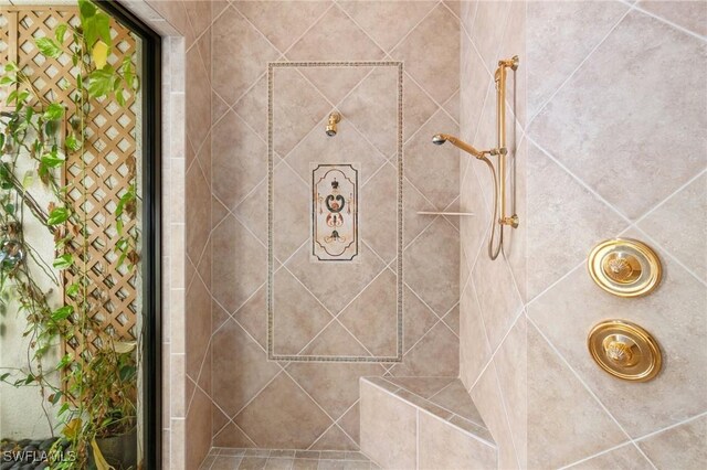 full bath featuring a tile shower