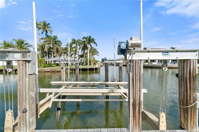 view of dock featuring a water view and boat lift