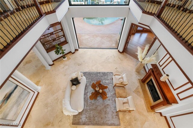 foyer entrance featuring a towering ceiling