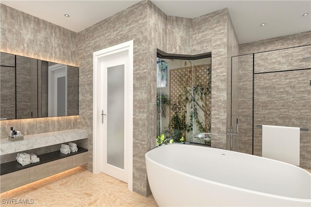 full bath featuring a soaking tub and tile walls