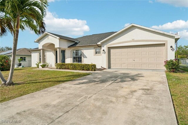 ranch-style home with a garage and a front lawn