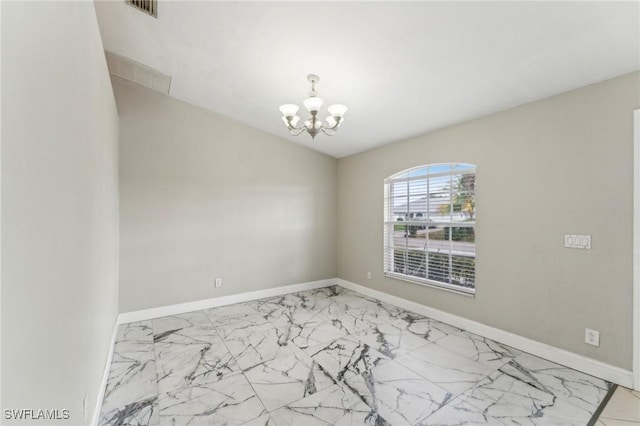 unfurnished room featuring a chandelier and vaulted ceiling