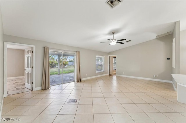 tiled spare room with vaulted ceiling and ceiling fan