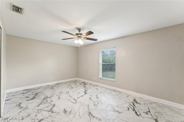 spare room with ceiling fan