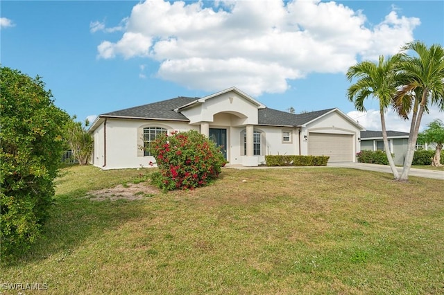 ranch-style home with a garage and a front yard