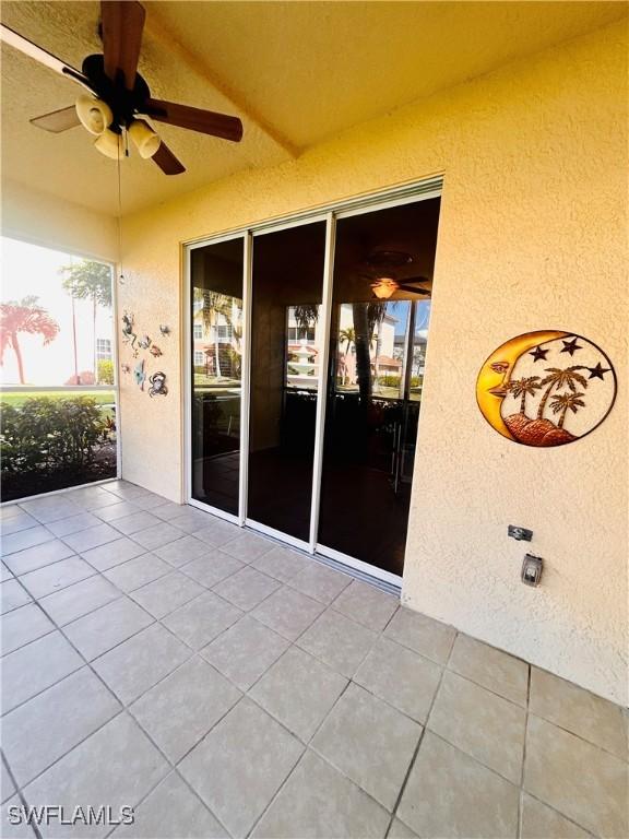 view of patio featuring ceiling fan