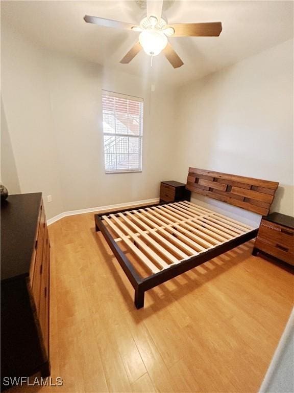 bedroom featuring a ceiling fan and light wood finished floors