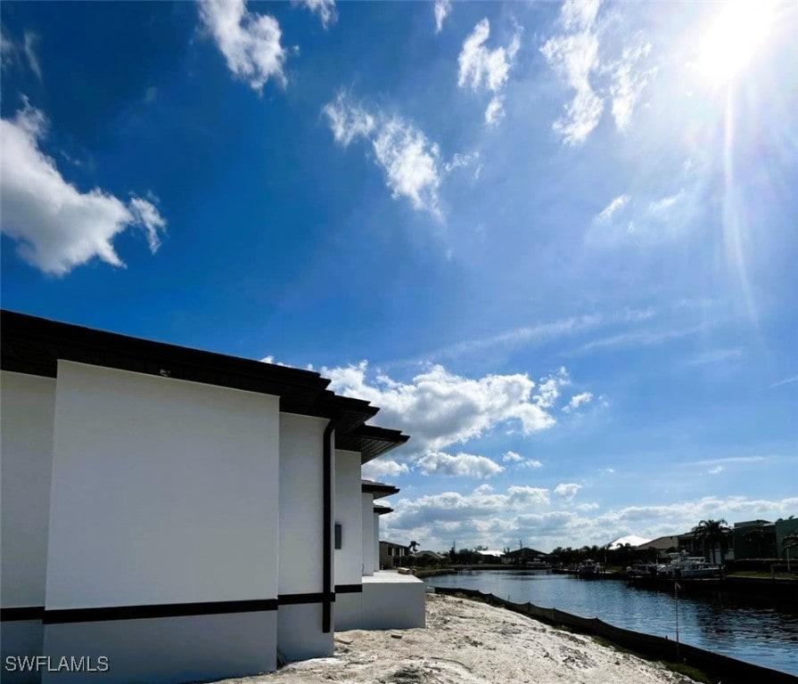 exterior space with a water view