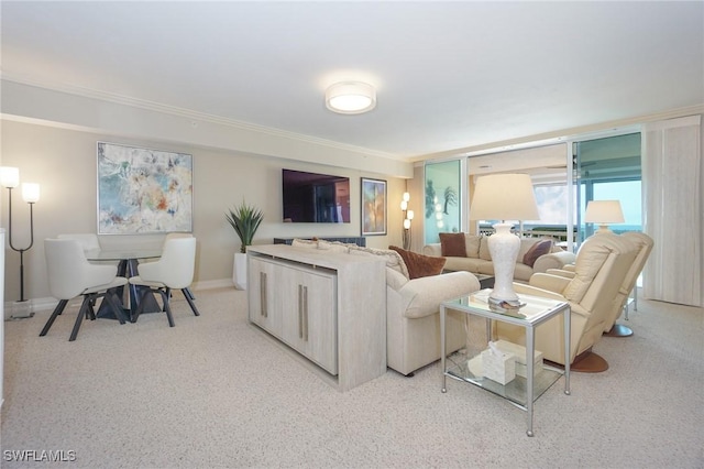 carpeted living room with crown molding