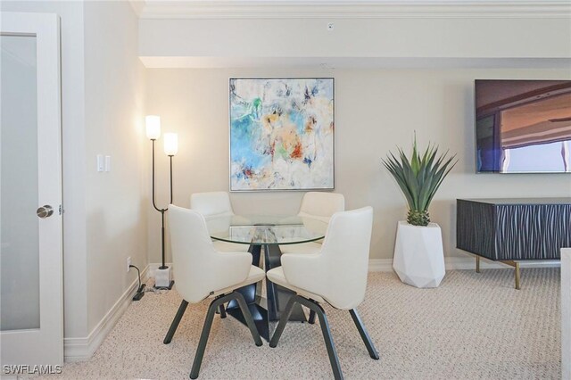 dining room with crown molding