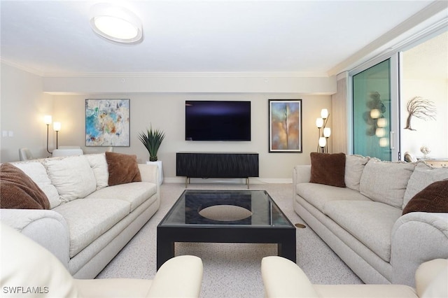 carpeted living room featuring ornamental molding