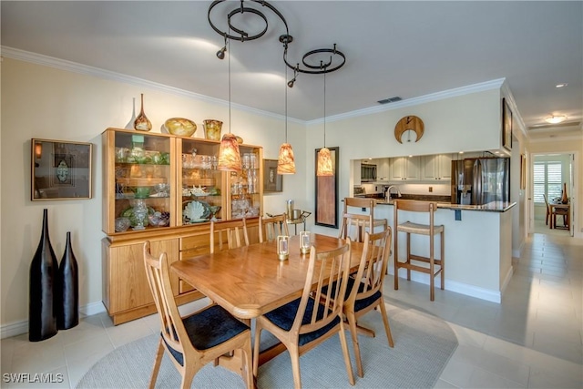 tiled dining space with crown molding