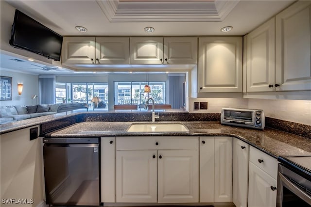 kitchen featuring sink, white cabinetry, crown molding, dark stone countertops, and dishwasher