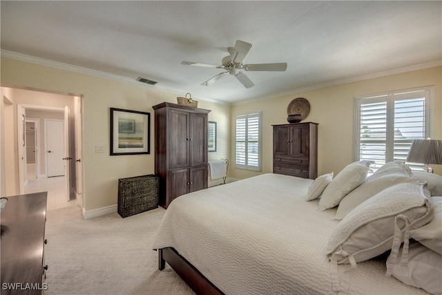 carpeted bedroom featuring crown molding and ceiling fan