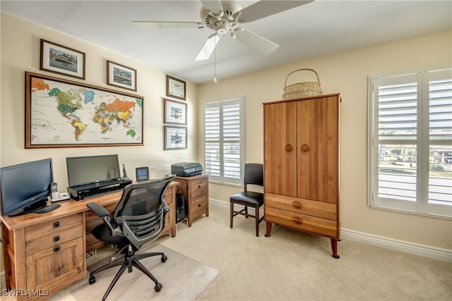 office with light carpet and ceiling fan