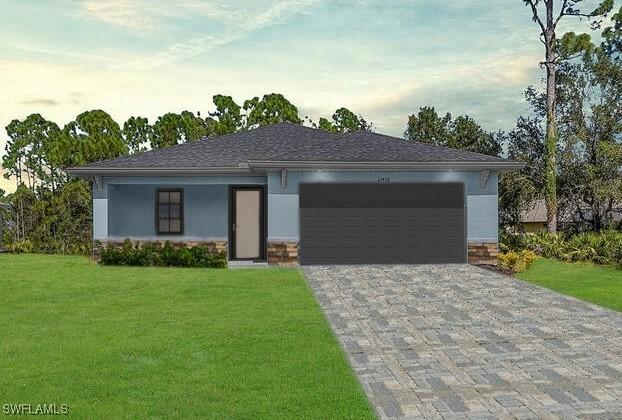 view of front facade featuring a garage and a lawn