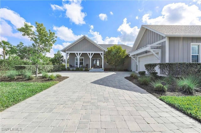 view of front of house with a garage and a porch