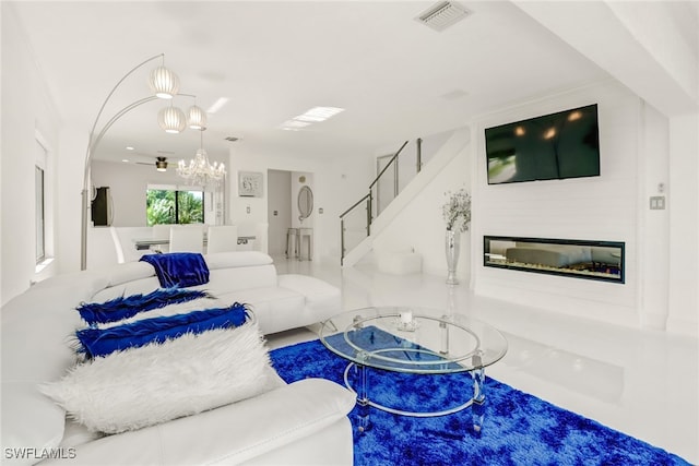 living room featuring a notable chandelier