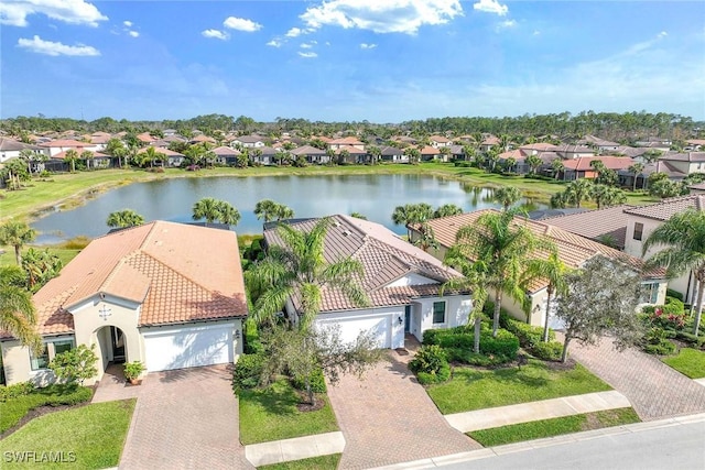 aerial view featuring a residential view and a water view