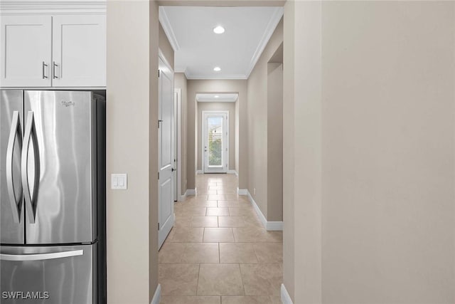 corridor with light tile patterned floors, baseboards, crown molding, and recessed lighting