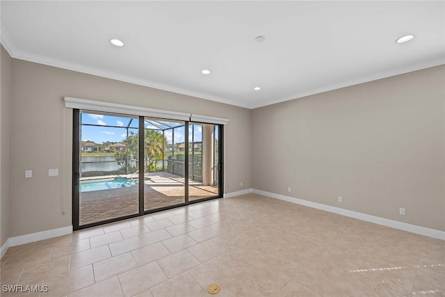 spare room featuring baseboards, crown molding, and recessed lighting