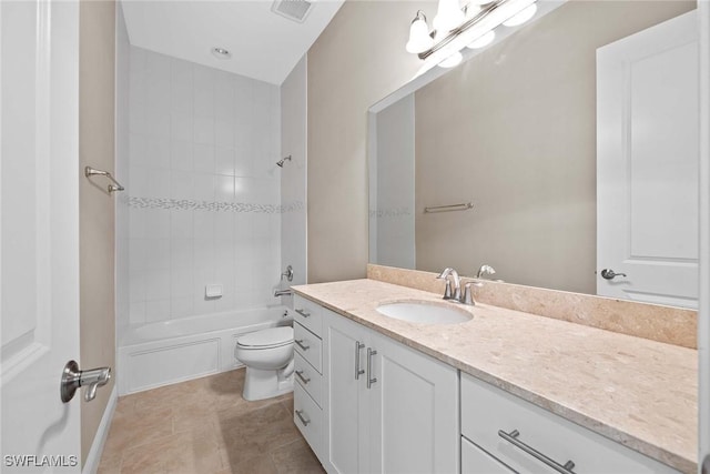 full bathroom with tile patterned flooring, toilet, vanity, visible vents, and shower / washtub combination