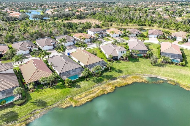 birds eye view of property featuring a residential view and a water view