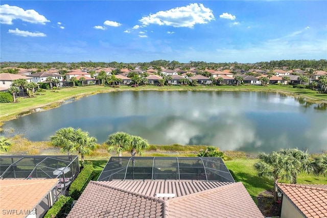 drone / aerial view with a water view and a residential view