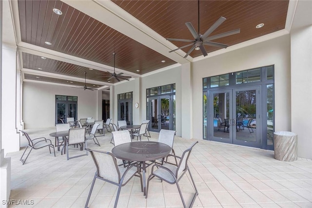 view of patio / terrace with ceiling fan, french doors, and outdoor dining area