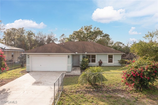 ranch-style house featuring a garage and a front yard