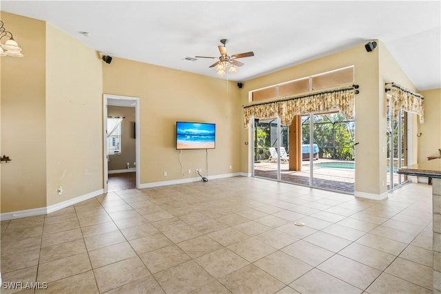 empty room featuring light tile patterned floors and ceiling fan