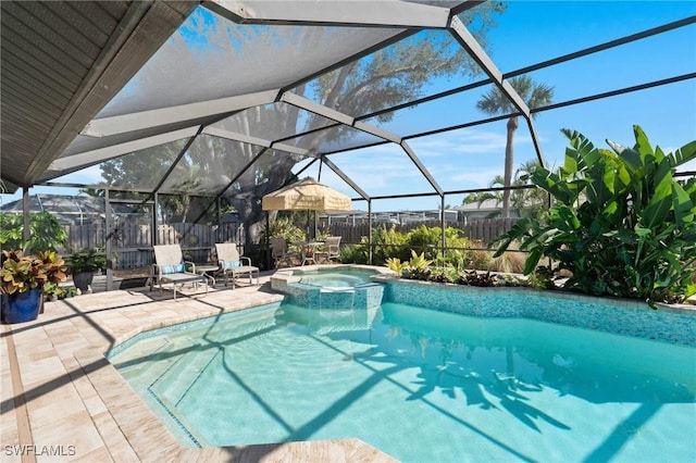 view of swimming pool with a patio, glass enclosure, and an in ground hot tub